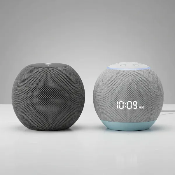 Side-by-side comparison of Apple HomePod Mini and Amazon Echo Dot 5th Gen smart speaker designs.